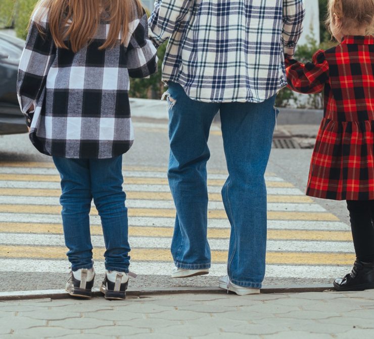 family-crossing-the-road-at-a-pedestrian-crossing-2022-11-15-11-42-13-utc